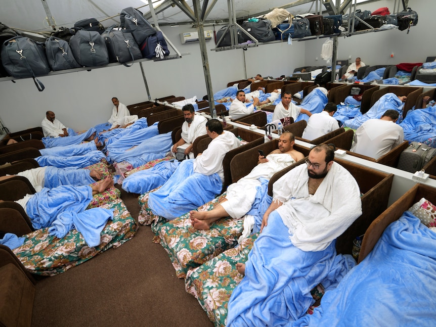 Muslim pilgrims resting inside a tent
