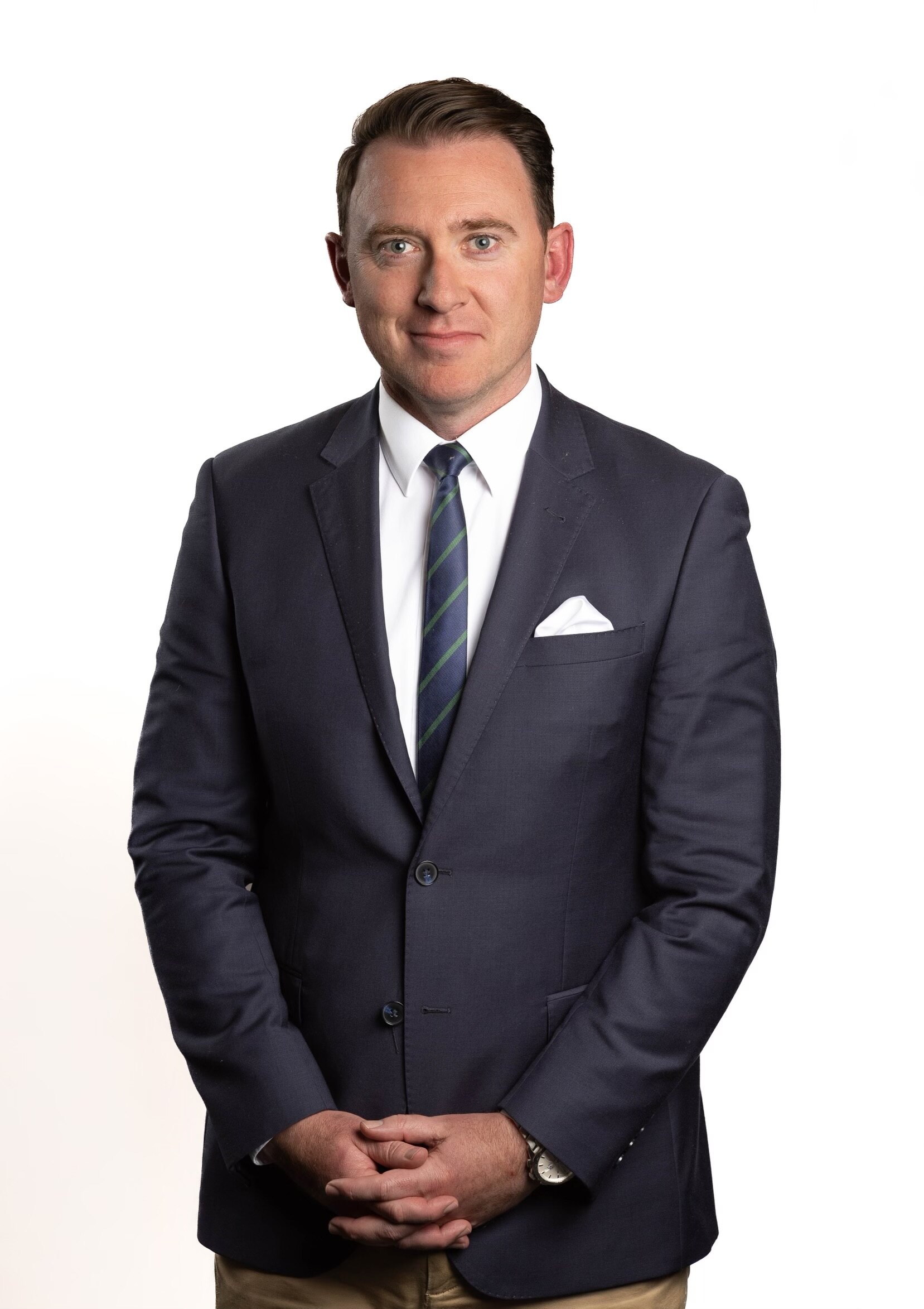 Headshot of man in suit and tie 