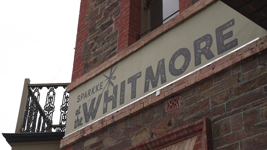 A sign on a building reading 'Sparkke at the Whitmore'