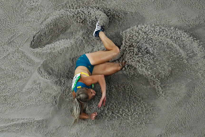 Australia's Chelsea Jaensch hits the sand while competing in the long jump at the 2016 Rio Games.