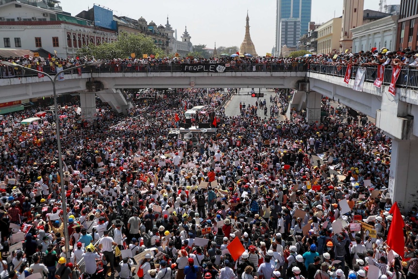 Demonstrators gather in an intersection close to Sule Pagoda to protest against the military coup in Yangon.