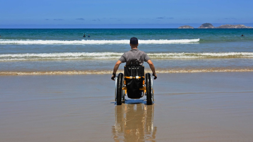 Steven Sweeney in a beach wheelchair