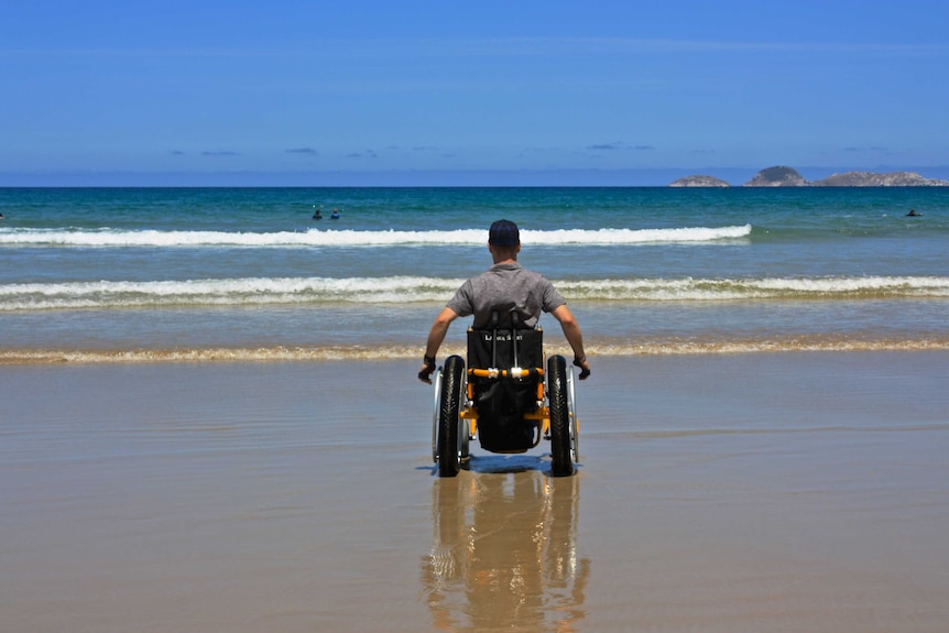 Steven Sweeney in a beach wheelchair