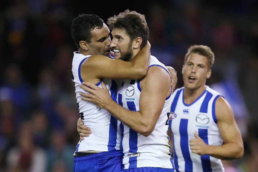 Jarrad Waite celebrates a goal with Lindsay Thomas