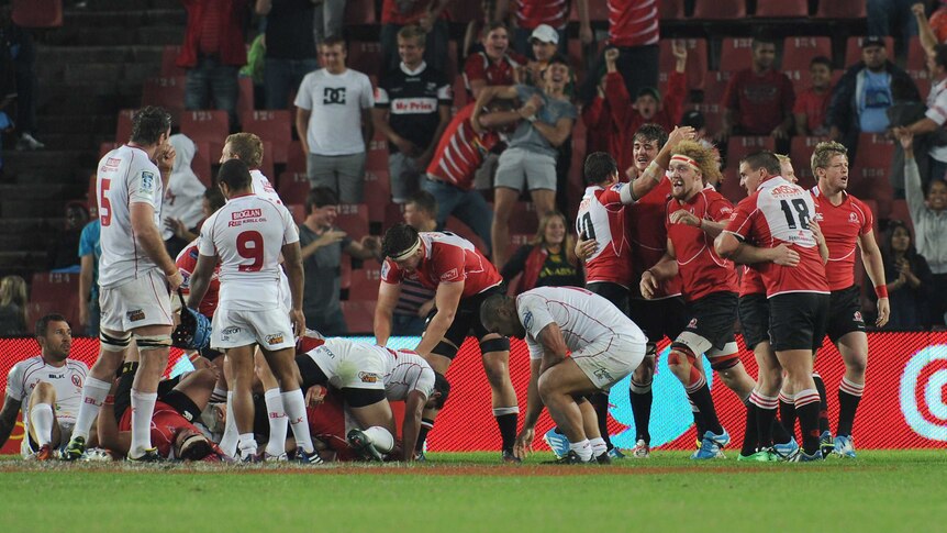 Lions celebrate their Super Rugby victory over the Reds at Ellis Park.