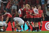 Lions celebrate their Super Rugby victory over the Reds at Ellis Park.