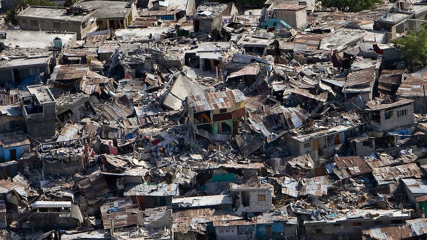 An urban area with many buildings destroyed, seen from high above