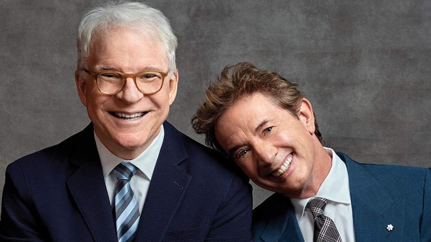 Comedians Steve Martin and Martin Short smile at the camera