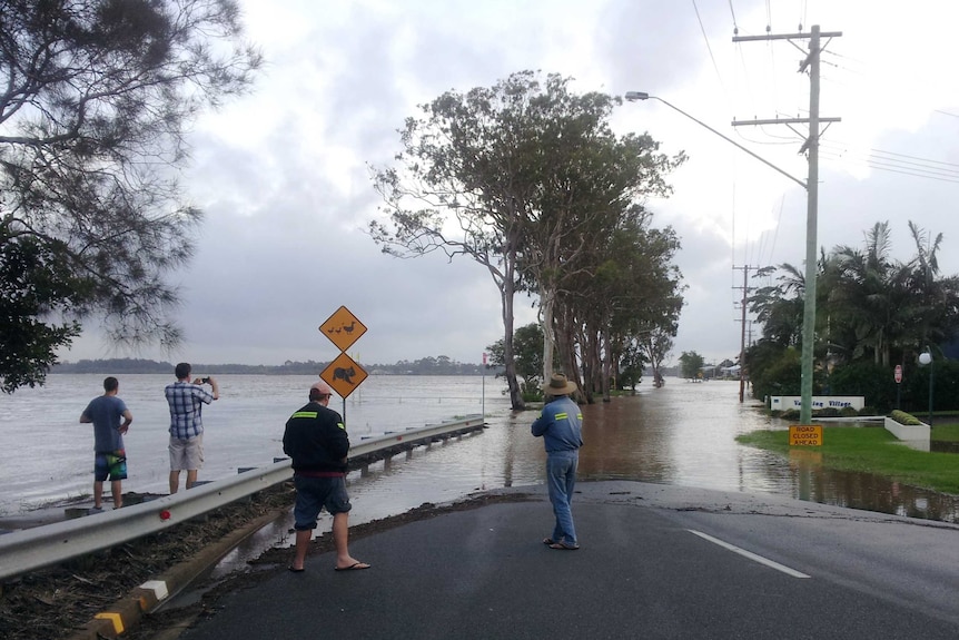 Locals watch the Hastings River near its peak at Port Macquarie in New South Wales