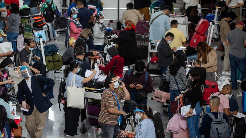 Passengers wearing face masks and face shields