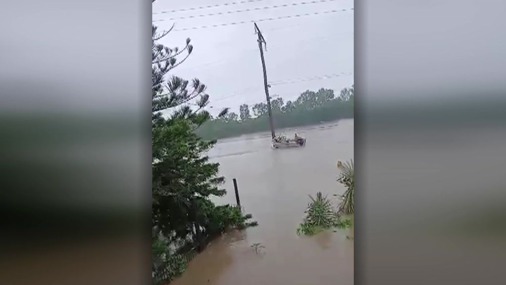 A man rescued from floodwater in Ingham. - ABC News
