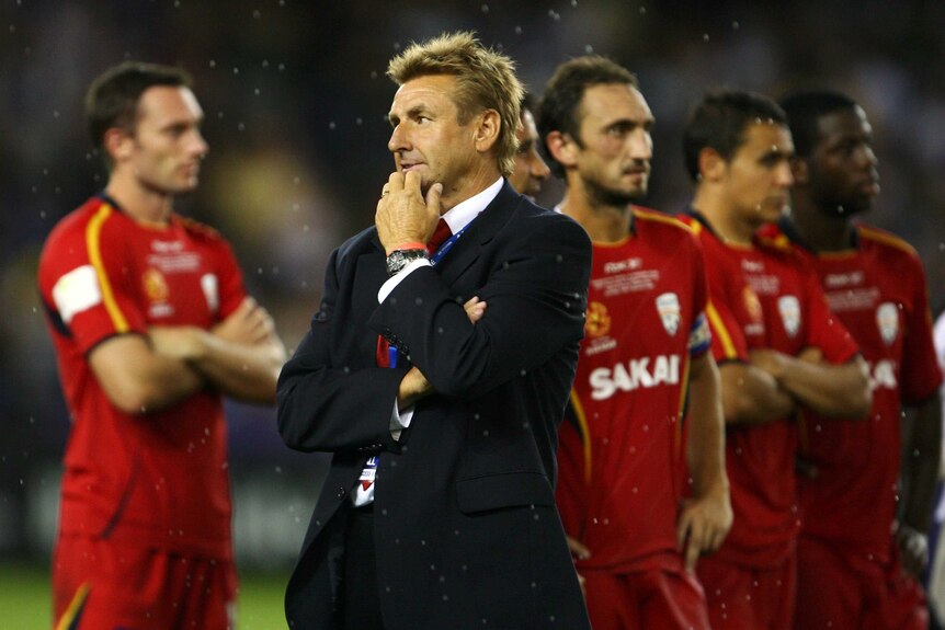 Adelaide coach John Kosmina looks dejected after Melbourne Victory wins 2007 A-League grand final.
