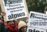 Indian protestors shout anti-government slogans during a protest against rape in New Delhi.