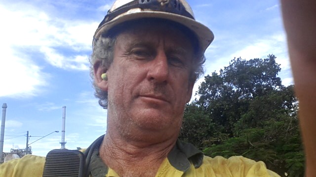 Ray Alexander wearing a hardhat when he worked at Queensland Nickel.
