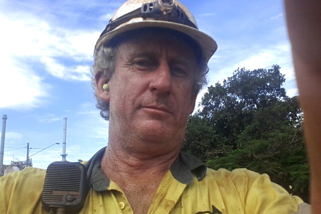 Ray Alexander wearing a hardhat when he worked at Queensland Nickel.