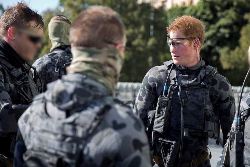 Prince Harry joined Navy divers for an exercise in the HMAS Sydney.