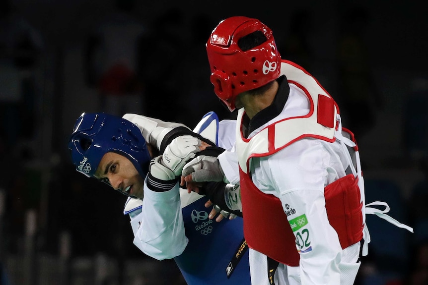 Tonga's Pita Nikolas Taufatofua and Iran's Sajjad Mardani compete in men's taekwondo in Rio.