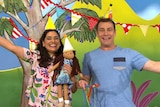 Teo and Leah and Kiya wearing party hats and with party decorations on the Play School set