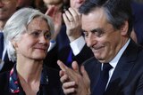 Conservative presidential candidate Francois Fillon applauds while his wife Penelope looks on, January 29 2017.