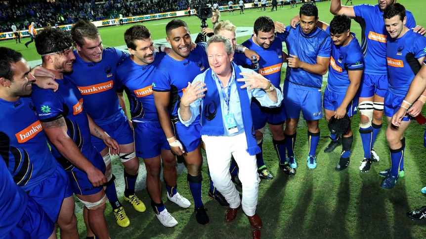 Mining magnate Andrew Forrest addresses Western Force players after their win over Fiji.
