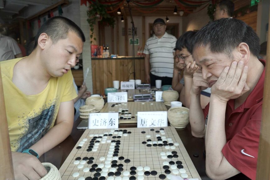 Amateur players during a game of Go