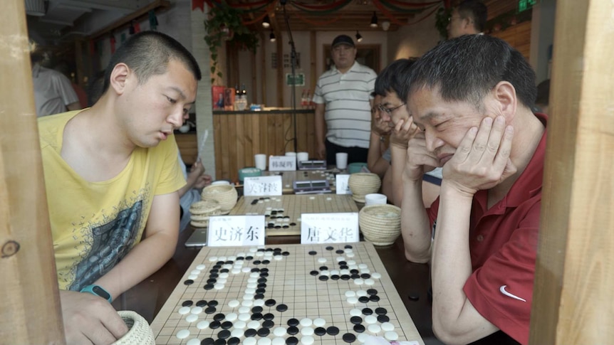 Amateur players during a game of Go