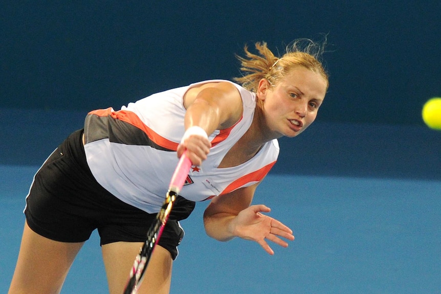 Jelena Dokic serves at the Brisbane International