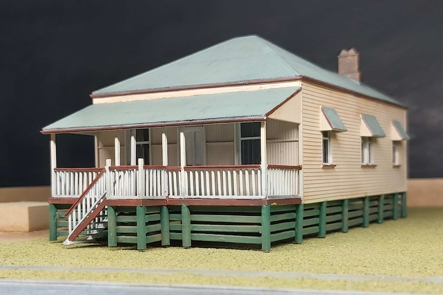 A miniature model of a raised workers cottage.