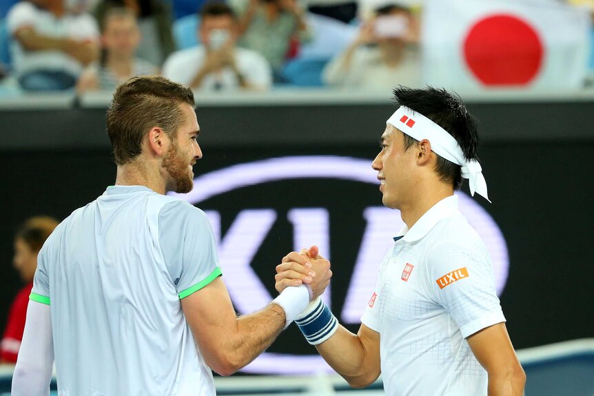 Friendly rivals ... Kei Nishikori (R) shakes hands with practice partner Austin Krajicek