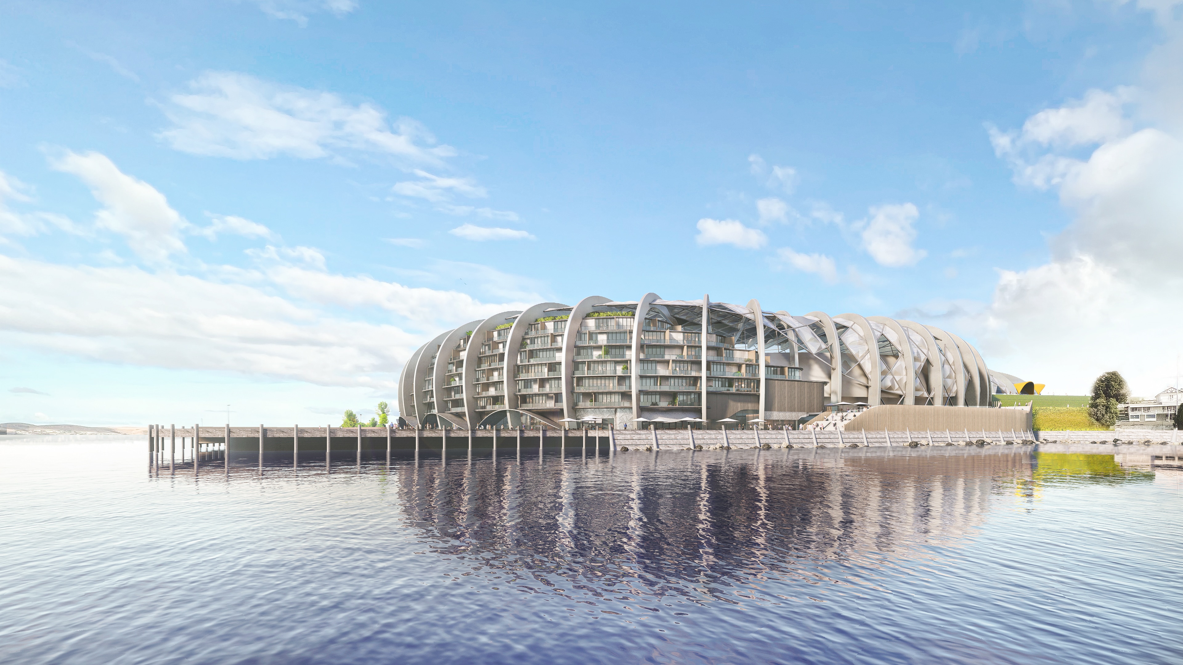 A artist's impression of a rounded silver building jutting into a river. 