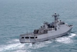Indonesian Navy ship sails on the Java Sea during search for the victims of AirAsia flight QZ 8501