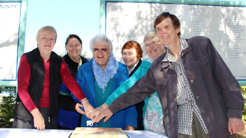 Presentation Sisters cut cake