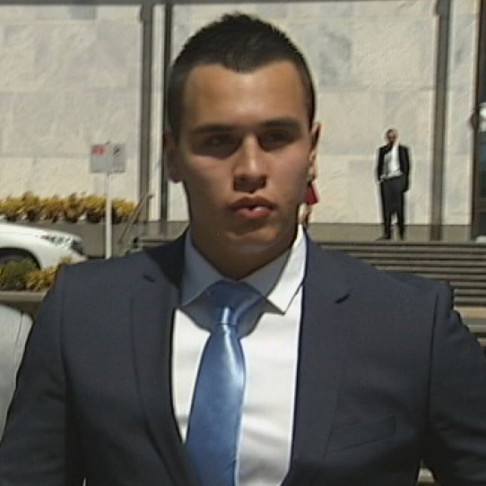 Daniel Byrne (right) leaves court after being found guilty of recklessly inflicting grievous bodily harm.