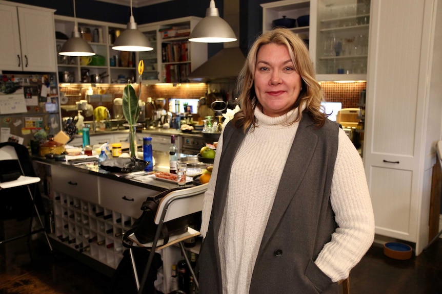 Lani Hannah stands in her kitchen.