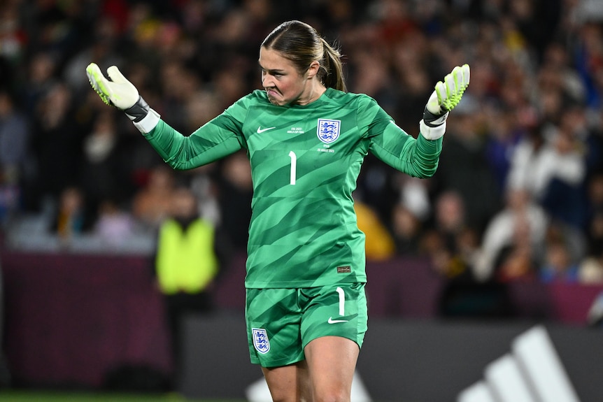 England goalkeeper Mary Earps pumps up the crowd after saving a penalty in the Women's World Cup final.