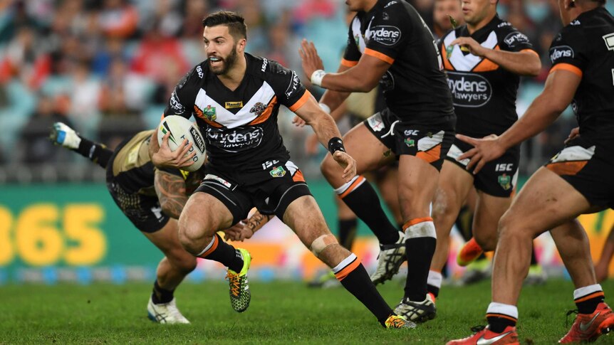 James Tedesco from Wests Tigers on the run against Penrith at the Olympic stadium in July 2016.