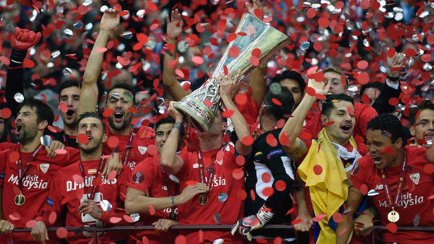 Sevilla celebrates with Europa League trophy