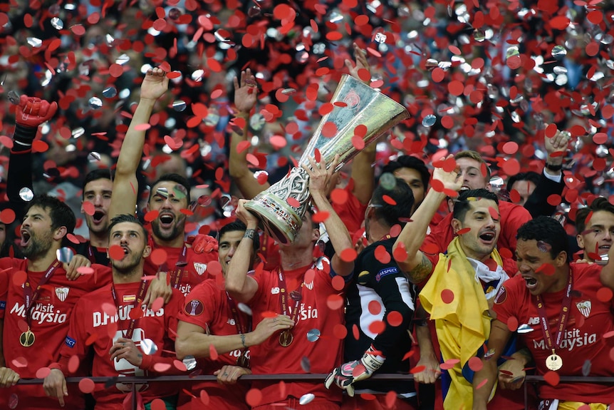Sevilla celebrates with Europa League trophy