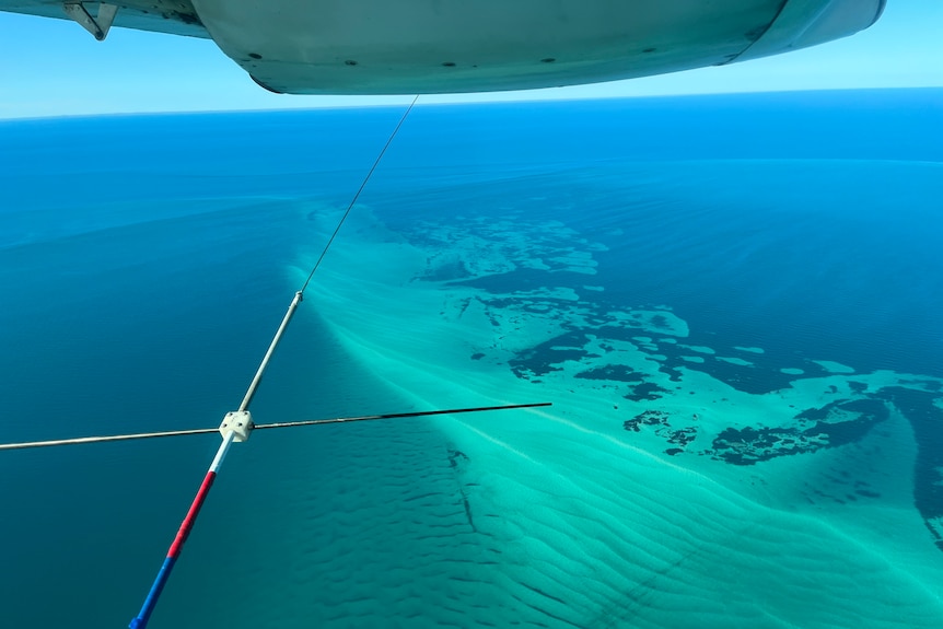 Looking down at shallow waters of Shark Bay from a small plane.