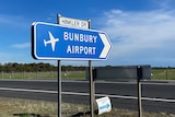 A sign pointing to the Bunbury Airport