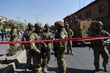 NATO soldiers arrive at the scene of a suicide car bomb in Kabul