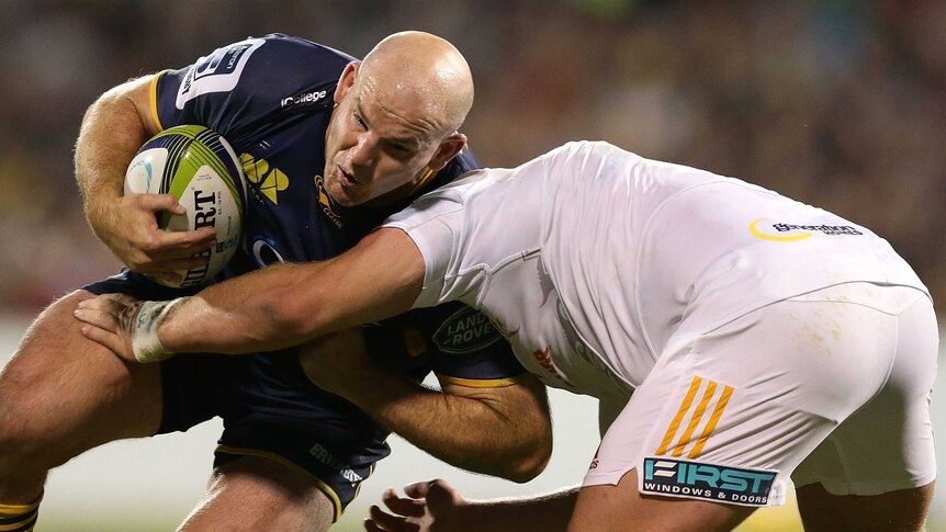Bruising encounter ... Stephen Moore meets the Chiefs defence