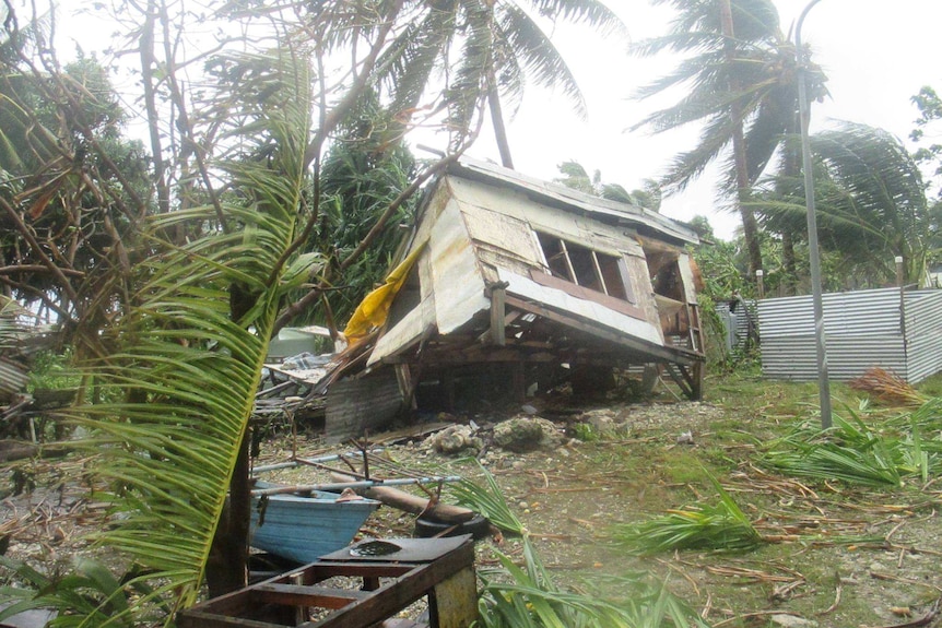 A house is blown over by strong winds in Tuvalu