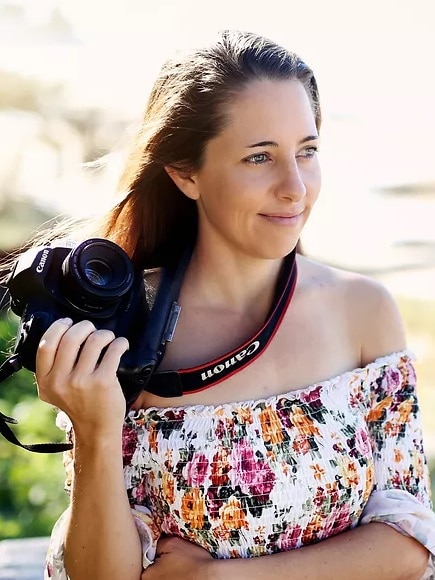 A woman holding a camera