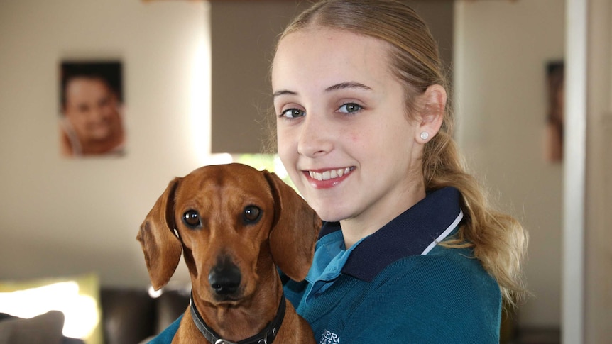 Schoolgirl with her pet dog
