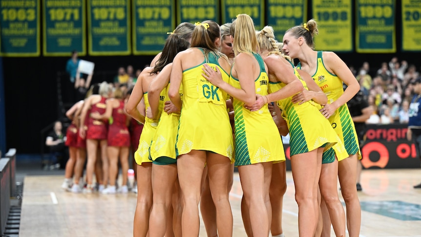 Diamonds players stand in a huddle with their hands in as they de-brief after their third win against England