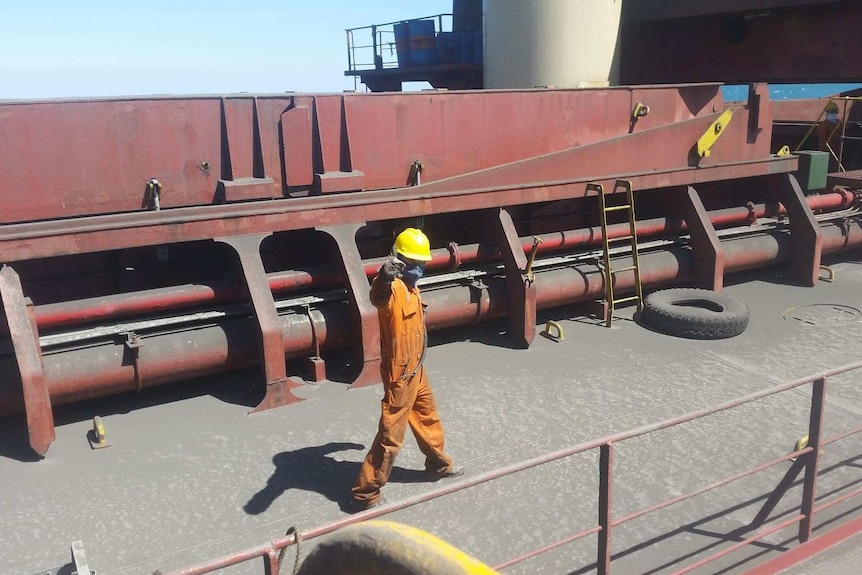 Worker onboard an export ship.