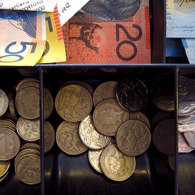 A cash drawer filled with Australian notes and coins.