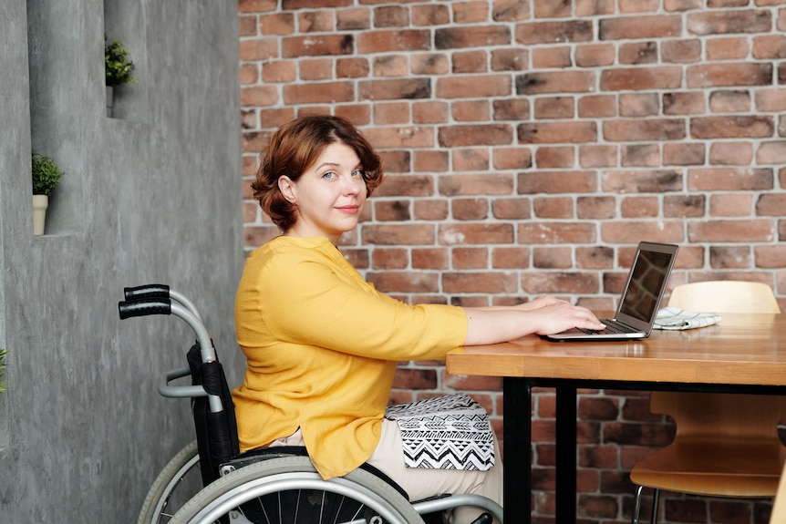 Woman working from home using a wheelchair