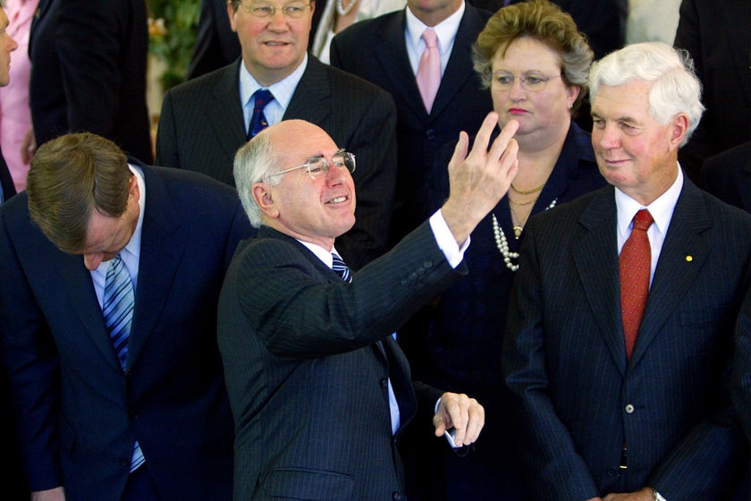 John Howard gestures